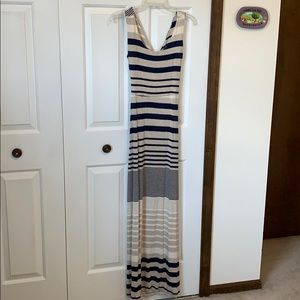 Fitted stripped maxi dress with open back detail